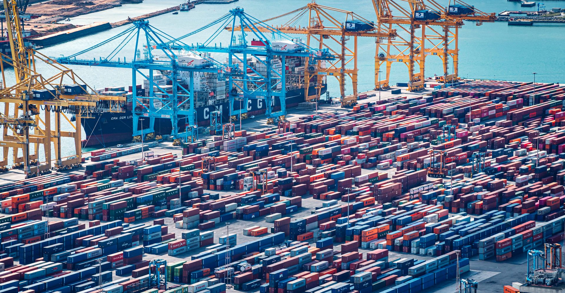 Container terminal with cranes and stacked shipping containers — LS International Group exports worldwide from China